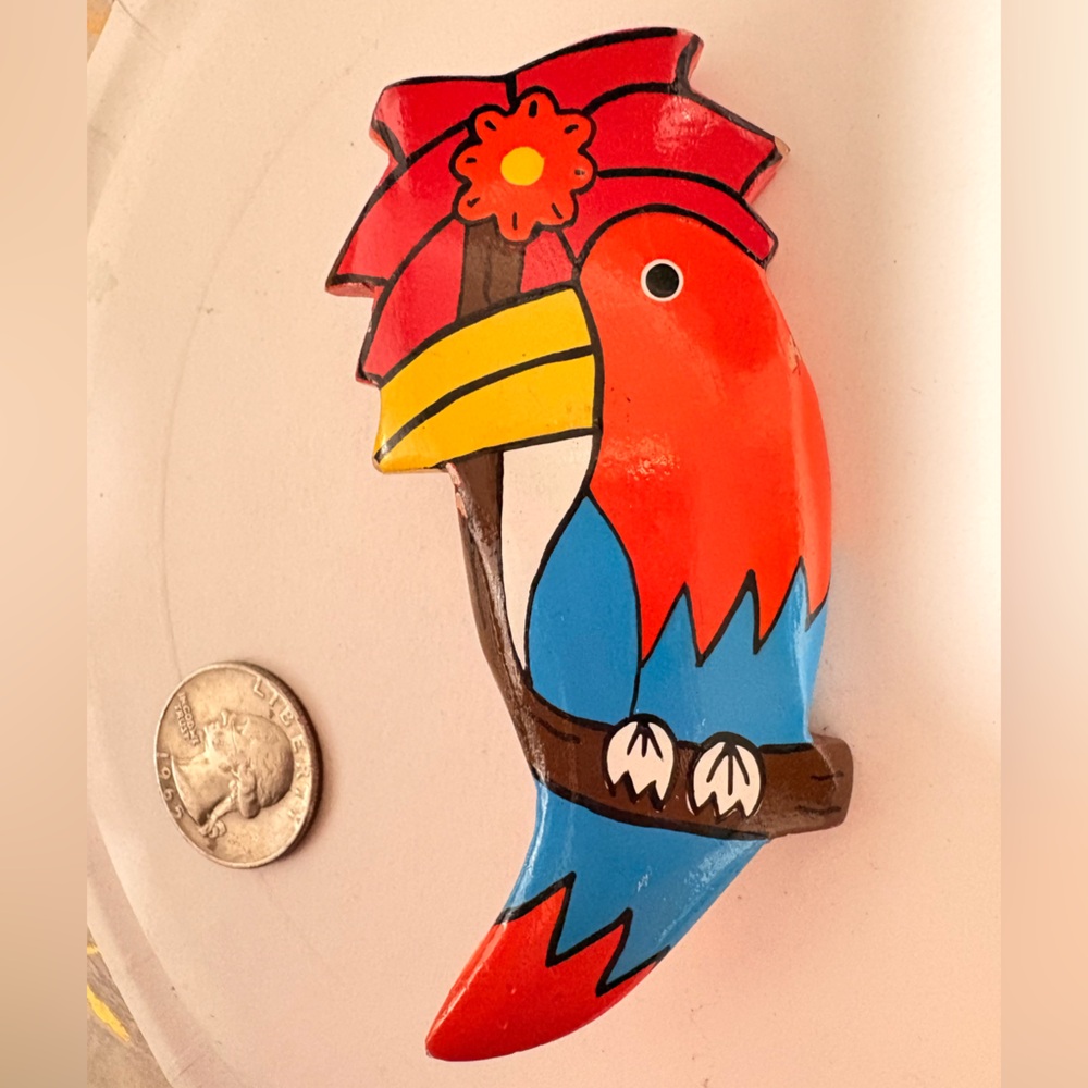 Vibrant vintage Parrot Brooch with Floral Accent